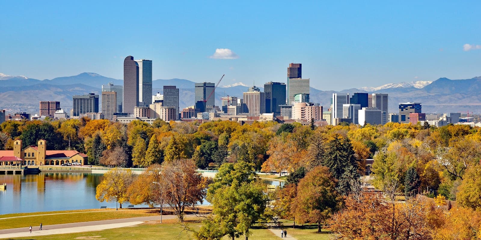 Rooftop terrace views toward the Denver skyline and Rocky Mountains from Lakewood, CO