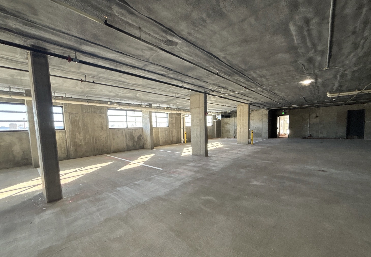 Secure underground parking garage for residents at The Cooper luxury apartments in Lakewood near Denver