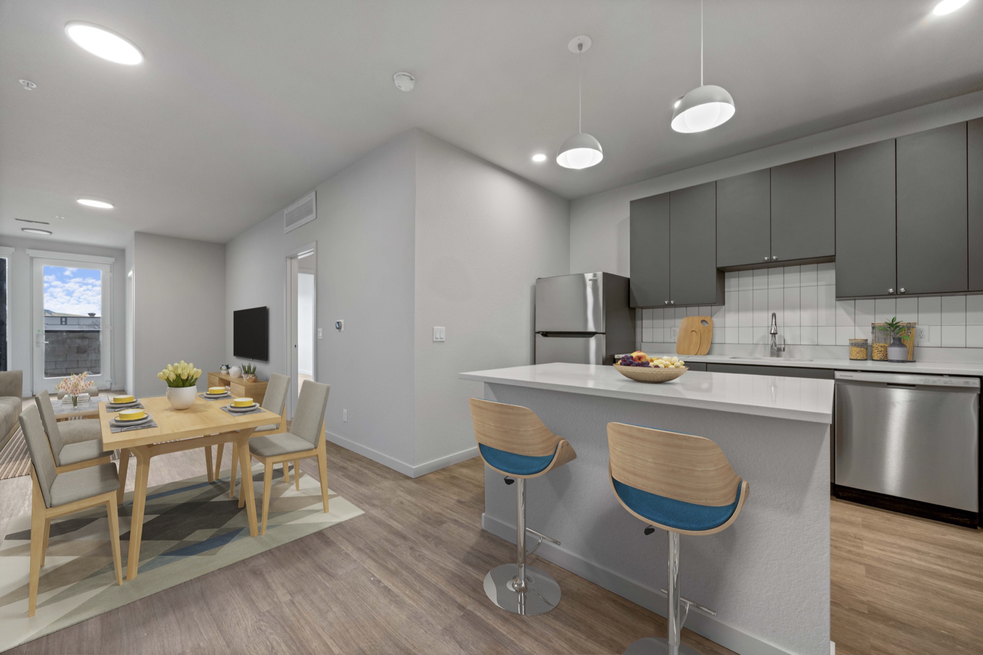 Modern gourmet kitchen with high-end appliances and designer cabinetry at The Cooper luxury apartments in Lakewood