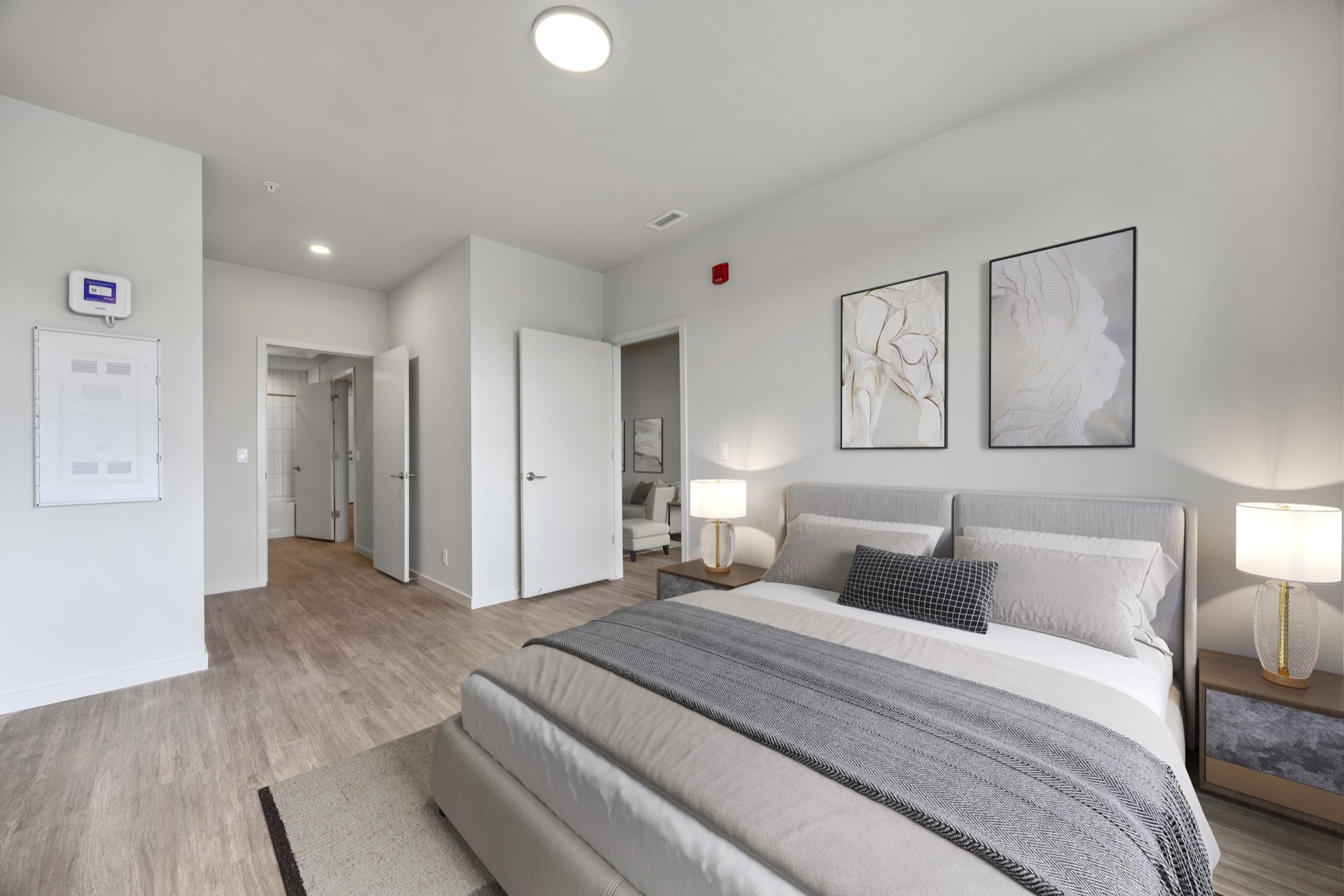 Elegant primary bedroom with designer finishes and natural light in a luxury residence at The Cooper near Denver